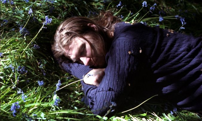 Aphex Twin laying in grass